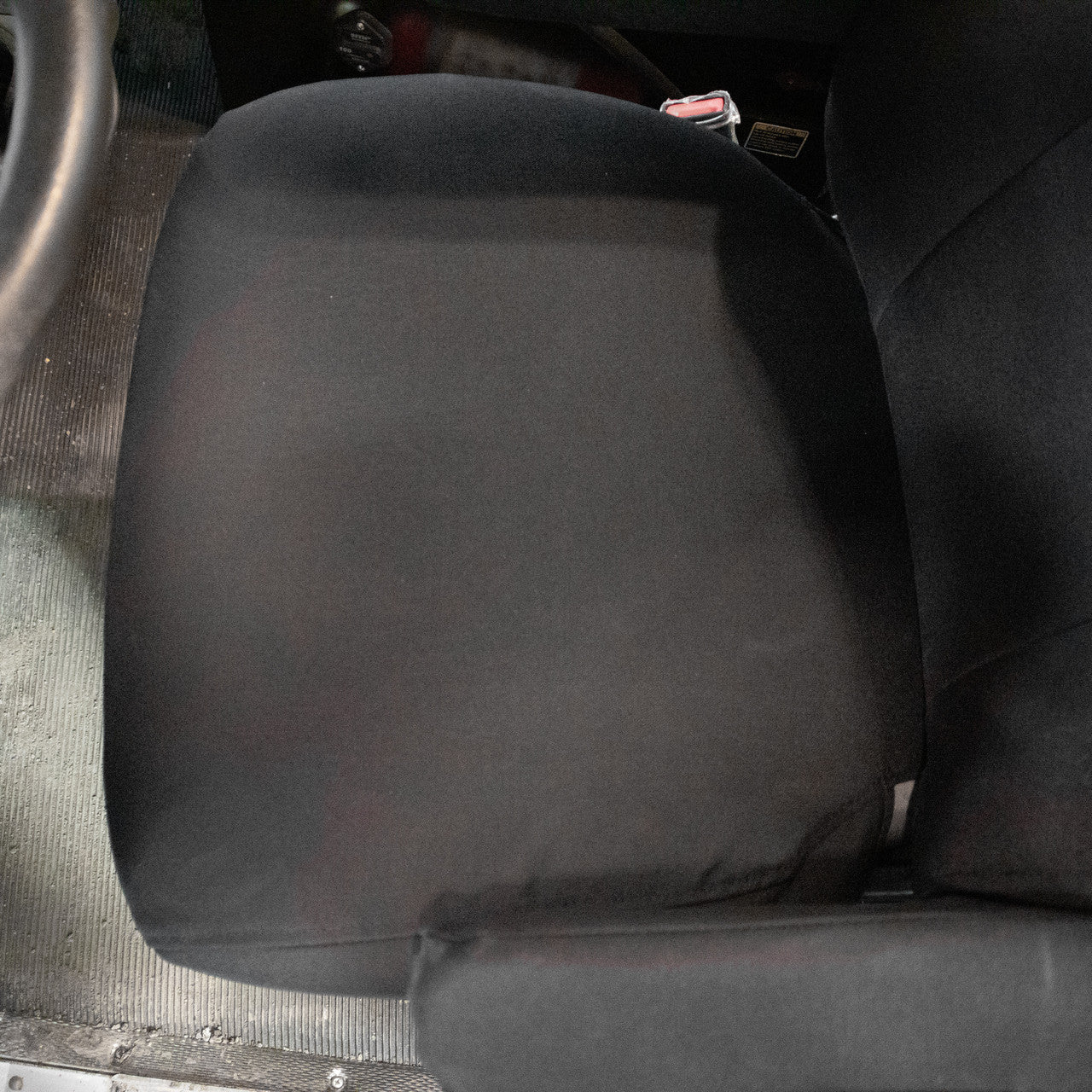 National Air Ride Seat with dual armrests and black IronWeave TigerTough Seat Covers