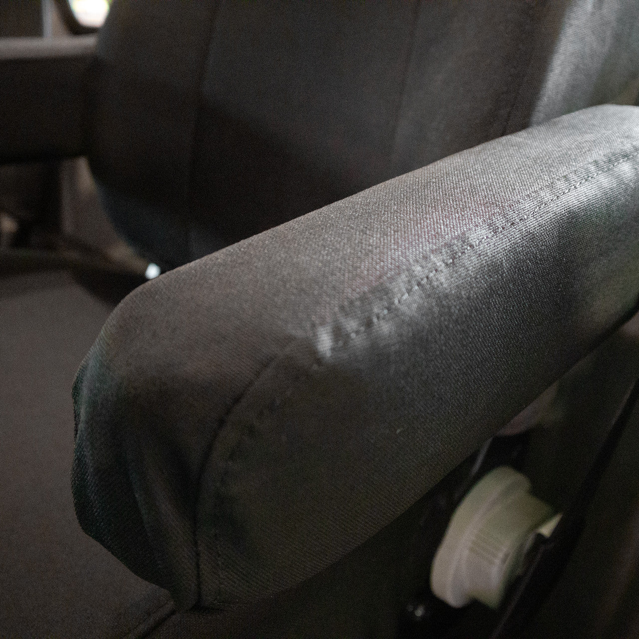 National Air Ride Seat with dual armrests and black Ironweave TigerTough Seat Covers