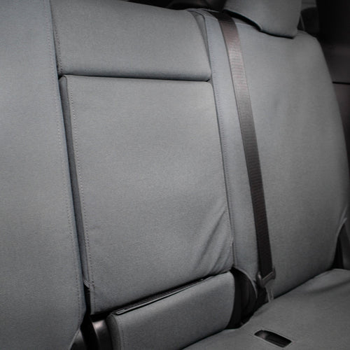 TigerTough Tactical Seat Covers on the rear seat of a Tesla Model Y - Folding Armrest Detail