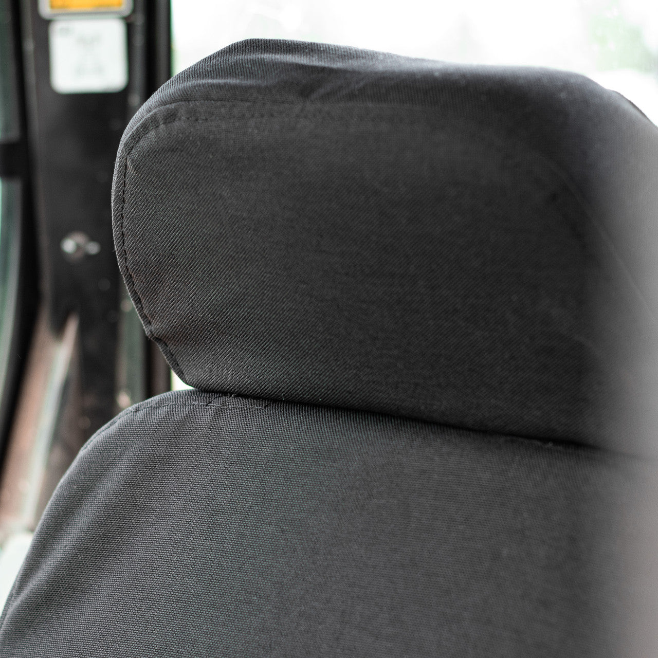 Custom fitting CAT equipment cover comes with a separate headrest
